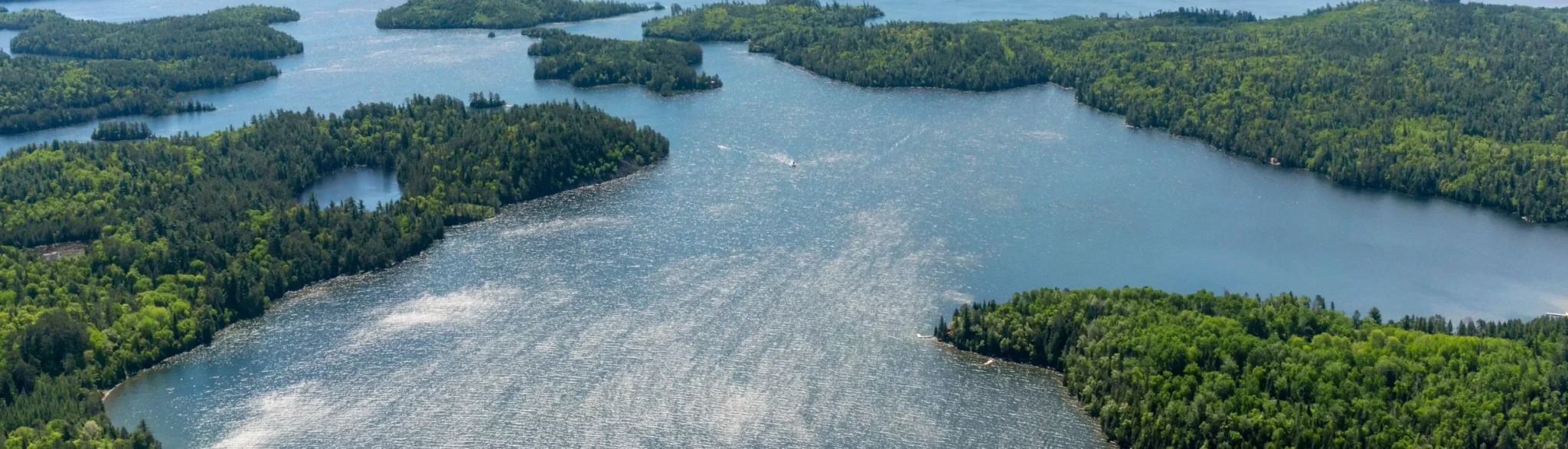 Panoramic aerial view of lush green islands and lake landscape
